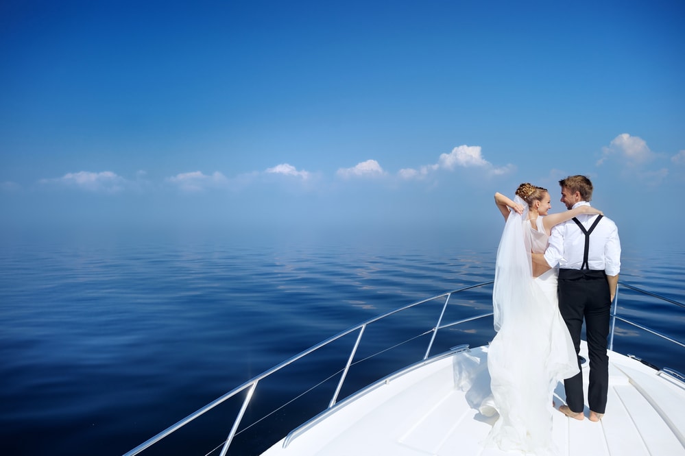 happy bride and groom on a yacht